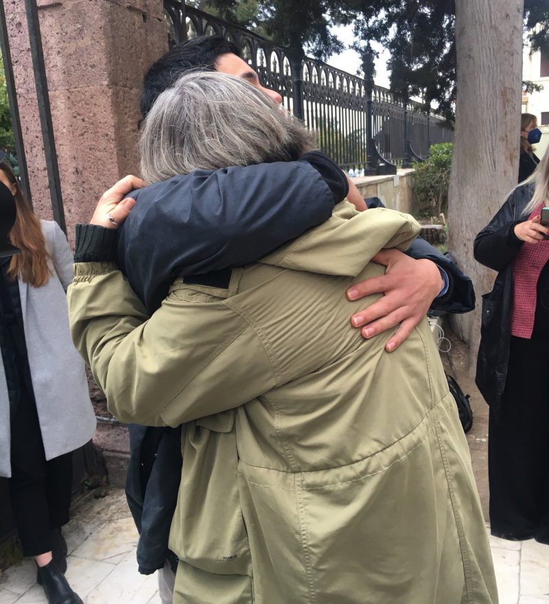 Seán Binder and his mother embrace outside the courtroom after the adjournment of the trial