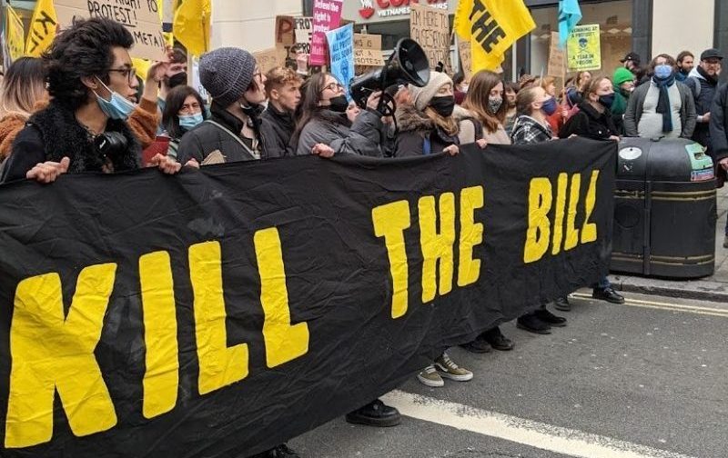 Kill the Bill demonstrators with a banner in central London