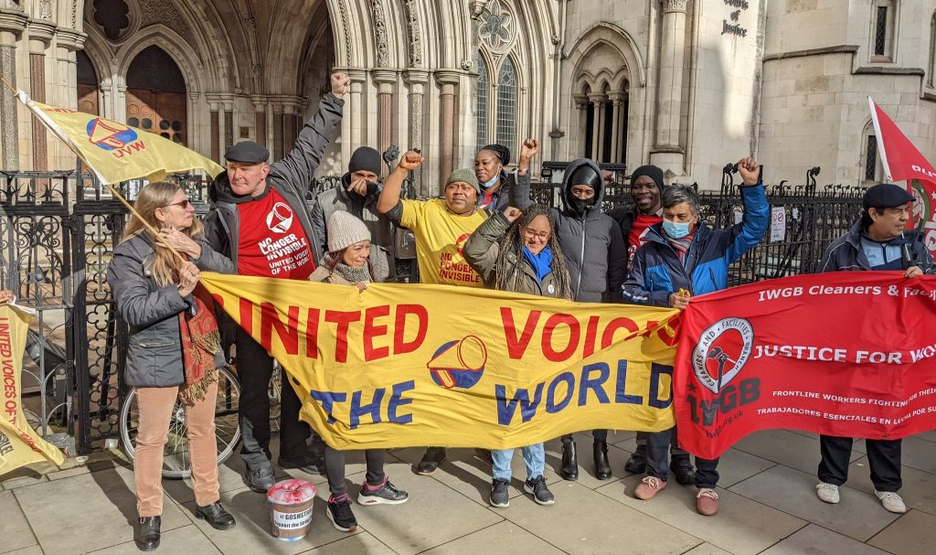 United Voices of the World members and supporters protest the injunction outside the Royal Courts of Justice