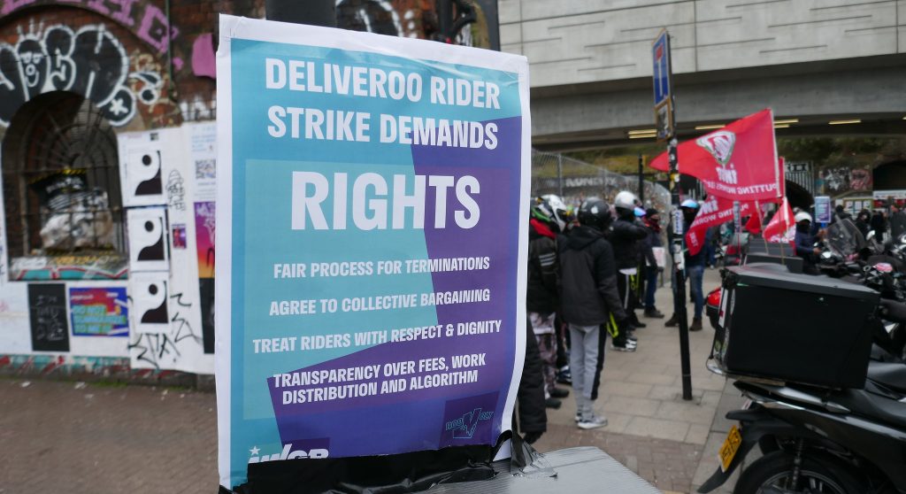 An IWGB Deliveroo strike leaflet stuck to a post