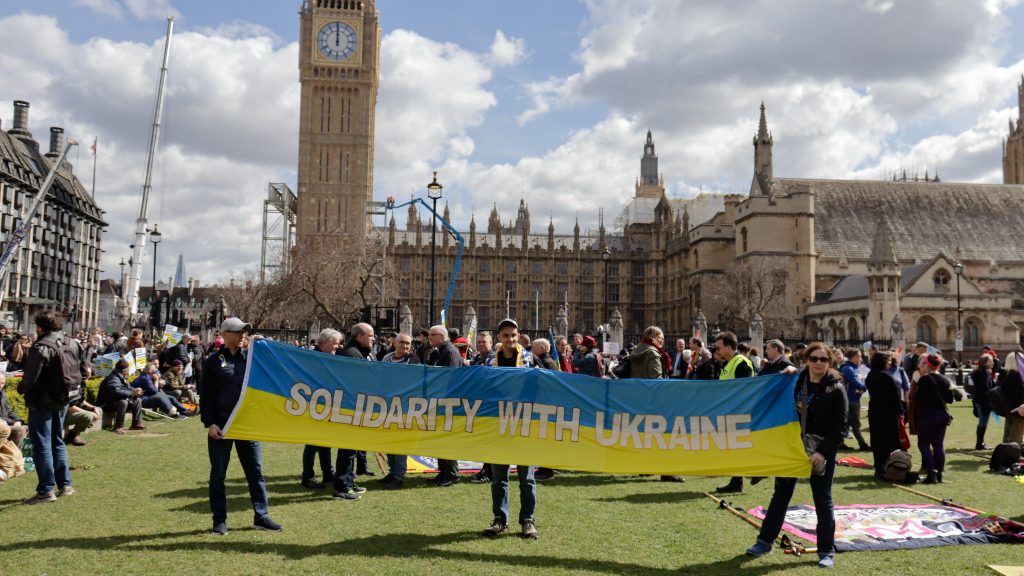 Two people holding a solidarity with Ukraine at a protest in London on 9 April 2022