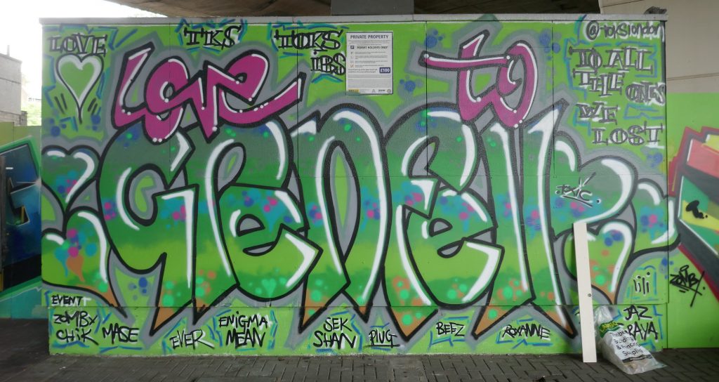 Grenfell graffiti that reads "Love to Grenfell" with the names of those lost