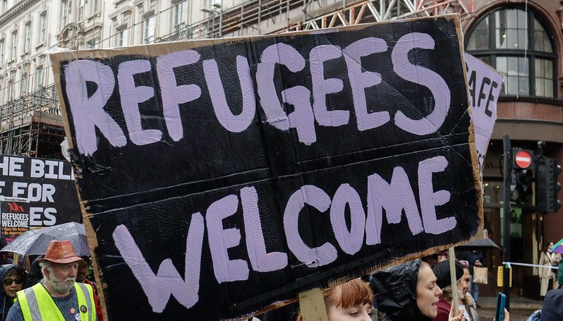 Refugees welcome placard held up at an anti-racism protest 18th MArch, London.