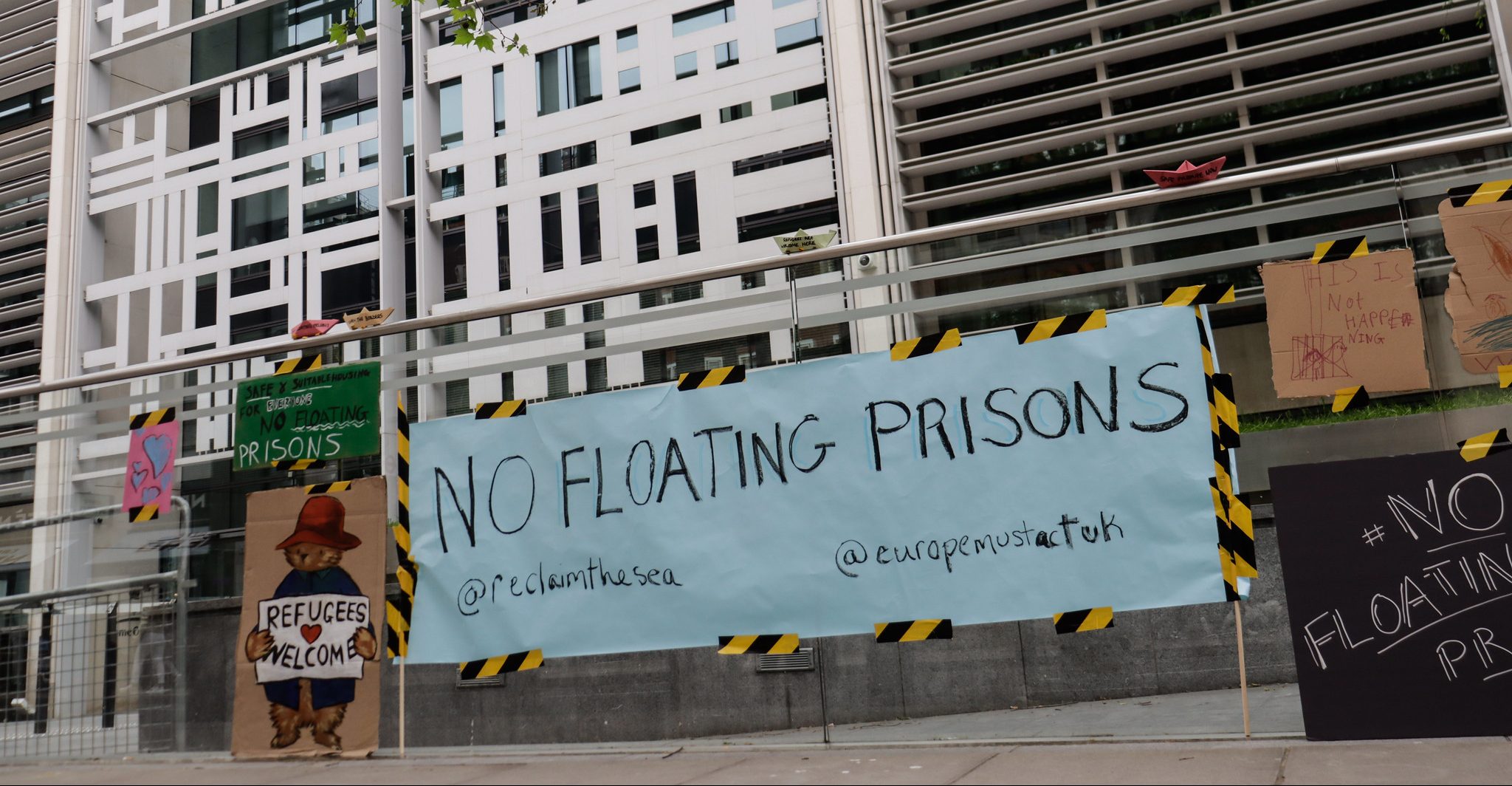 A no floating prisons banner outside the Home Office, central London