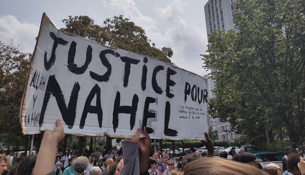 The marche blanche for Nahel Merzouk - a placard saying Justice pour Nahel