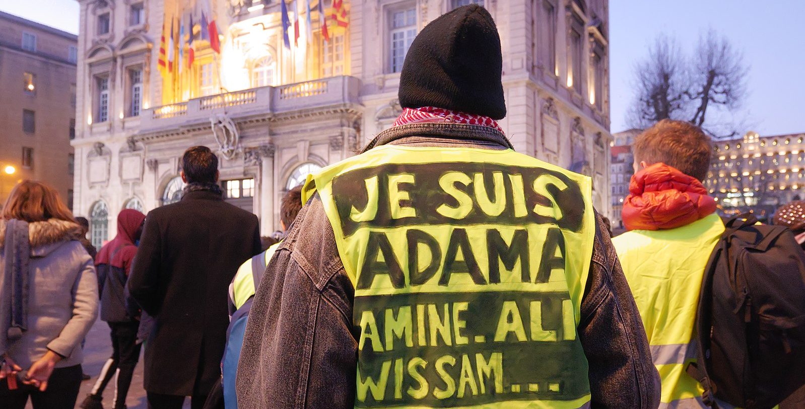 Je Suis Adama hi-vis on a protester in France